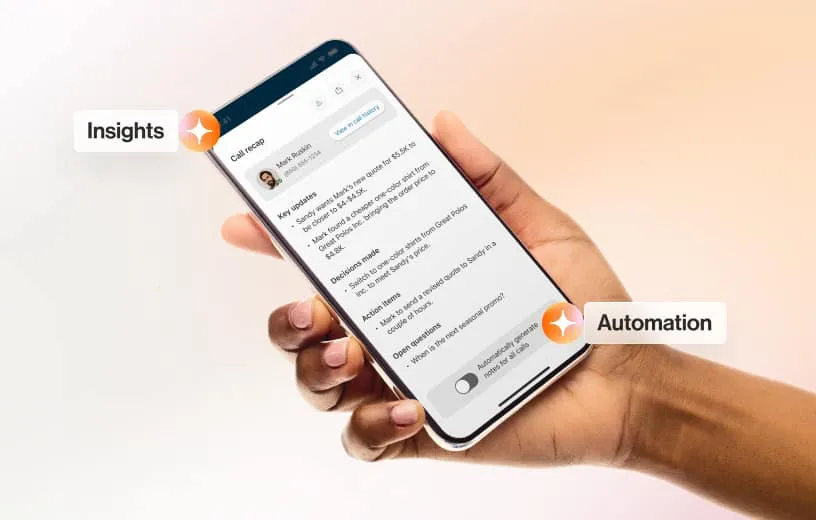 A hand holds a smartphone displaying a screen with text and toggles labeled "Insights" and "Automation" with small orange star icons beside them.