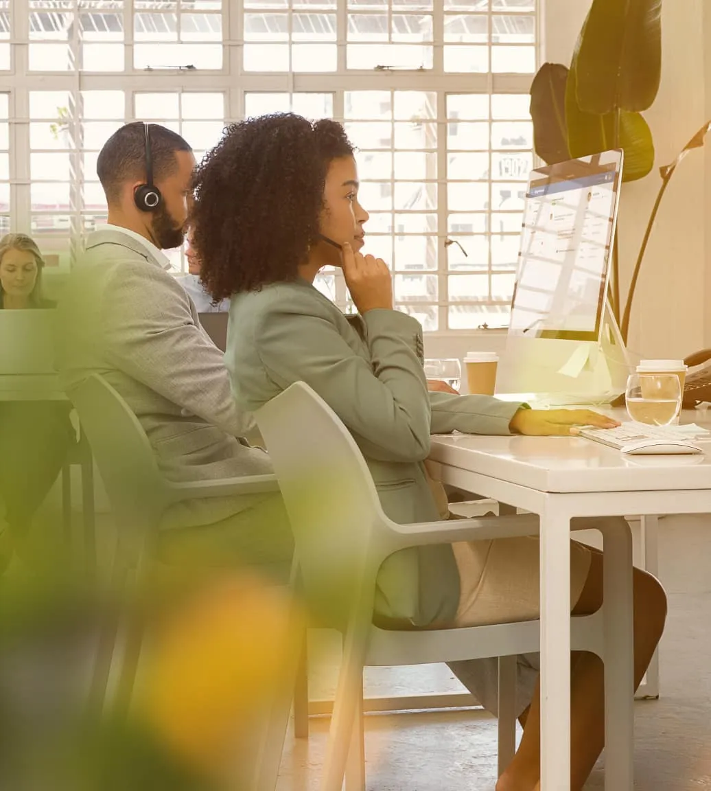 Male and female employees working on their laptop