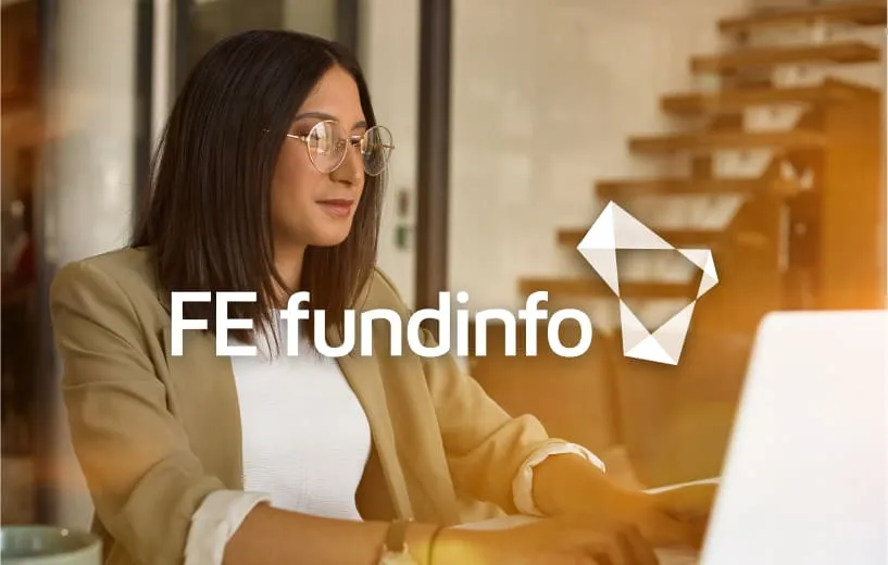 A woman working on a laptop with an overlay of the H&CO logo